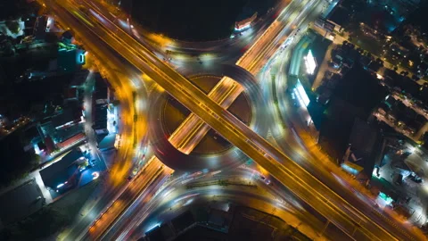Night time lapse drone top view circular zoom out illumination traffic street in Video stock 265614208