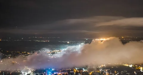 Night time lapse of fog moving over the town Kranj Stock Footage 219689959