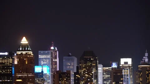 Night Time-Lapse of the Full Moon rising behind the New York City Skyline Stock Footage 63637384