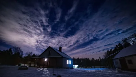 Night time lapse with house under starry sky with clouds. Stock Footage 166598909