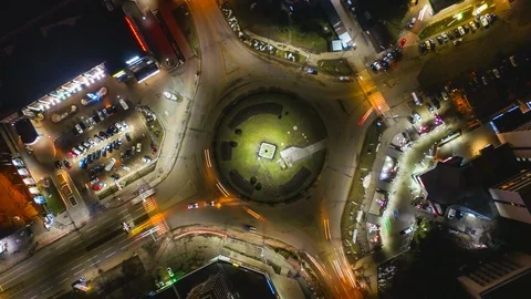 Night time lapse with intersection ring and cars light in night town Stock Footage 123875577