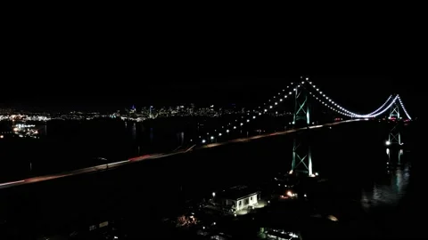 Night time lapse of the Lions Gate Bridge in with downtown Vancouver, BC in the Stock Footage 142844569