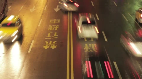 Night time-lapse looking down at traffic on busy city street in Taipei, Taiwan Stock Footage 56966709