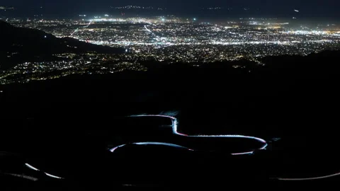 Night time lapse of mountain desert highway above Palm Springs California Stock Footage 155424952