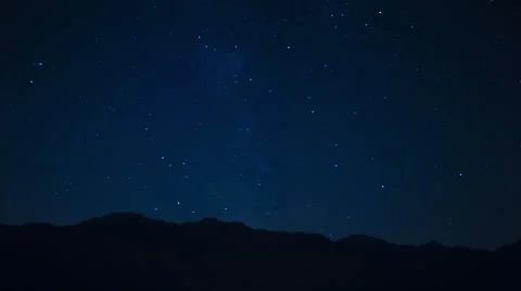 Night time lapse with mountain landscape and falling stars Stock Footage 53652896