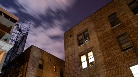 Night time lapse over brick apartments. Stock Footage 308118
