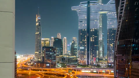 Night time lapse of Road traffic and high rise building in Dubai down town Stock Footage 261324488