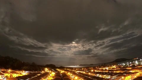 Night time lapse - running the clouds over a residential village in Phuket Video stock 164921134