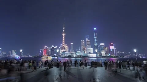Night Time-lapse of Shanghai Bund with Illuminated Pudong Skyline and Crowd Stock Footage 334023612