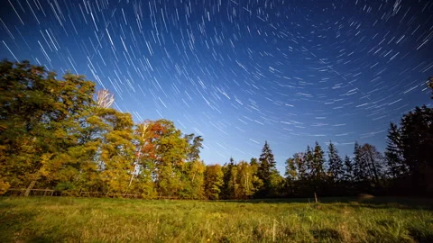 Night time lapse with startrails and autumn landscape. Stock Footage 288565009