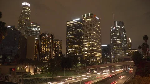 Night time-lapse of traffic and downtown LA skyline with clouds Stock Footage 83146157