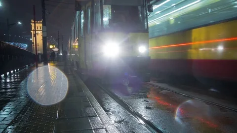 Night time lapse of tram stop at Poniatowskiego's bridge. 動画素材 73977508