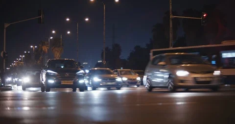 Night time lapse view of traffic on a busy city crossroad, down shot Stock Footage 120237498