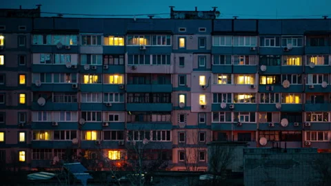 Night Time-lapse in the Windows of a Multi-story Building Stock Footage 260463743