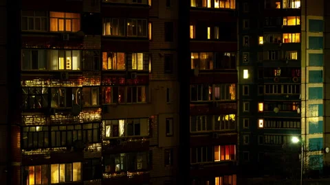 Night Time-lapse in the Windows of a Multi-story Building Stock Footage 260532826