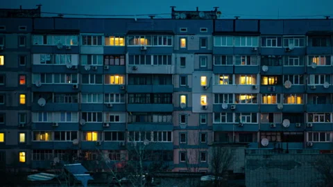 Night Time-lapse in the Windows of a Multi-story Building Stock Footage 260800625