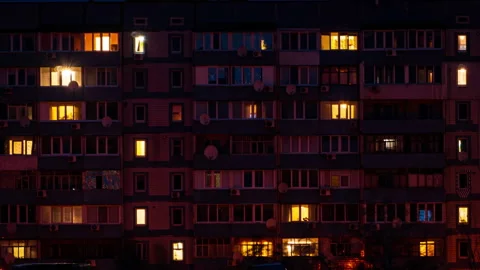 Night Time-lapse in the Windows of a Multi-story Building Stock Footage 261964637