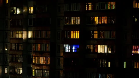 Night Time-lapse in the Windows of a Multi-story Building Stock Footage 263235906