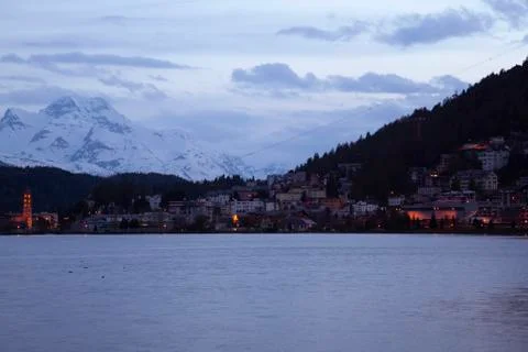A night time panorama of the high alpine upscale resort town of St. Moritz. Stock Photos
