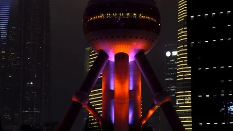 Night time Pearl tower metropolis skyscraper panning shot. Stock Footage 93648161