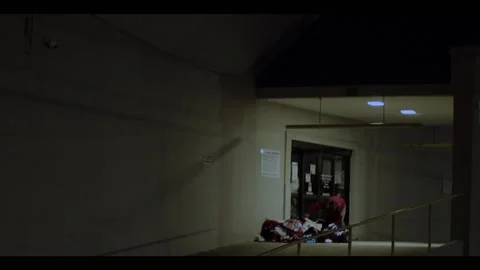 Night time person going through a pile of donations at the Goodwill drop off Stock Footage 152170164