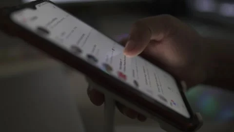 Night time a person using smartphone scroll Stock Footage 290950975