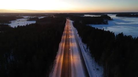 Night time road with sunset background in winter Finland Stock-Footage 261740777