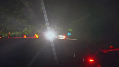 Night time scene with emergency vehicles and police lights flashing Stock Footage 111848471