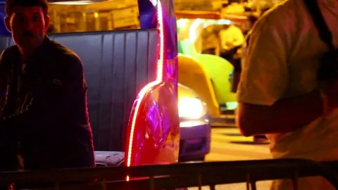 Night time shot of lights and tourists Stock Footage 78539582