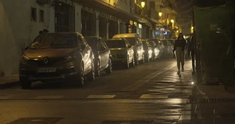 Night time street scene in Nerja NIght life with traffic Stock Footage