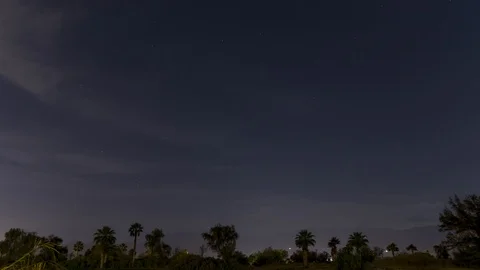 Night time timelapse palm trees mountains and cloud movement in Palm Springs, CA Stock-Footage 109248008