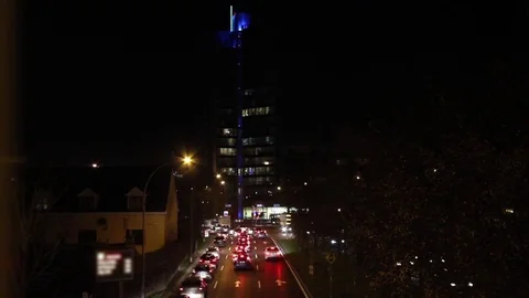 Night-time timelapse skyscraper and traffic Stock Footage 79509304