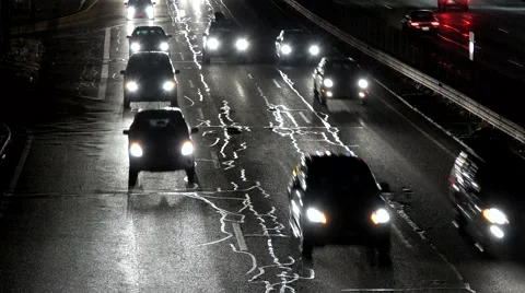 Night time traffic car headlights Stock Footage 45554627