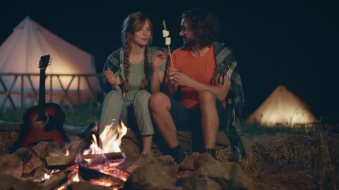 In the night time very charismatic guy and his girlfriend have a romantic time Video stock 243117063