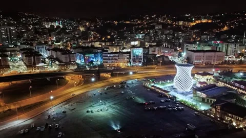 Night time view of a city with a large tower in the middle Stock Footage 268914571