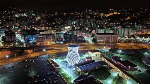Night time view of a city with a large tower lit up Stock Footage 268914808