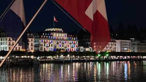 Night Time View Of Hotel Schweizerhof From The Famous Lake Bridge In Lucerne Stock Footage 346188927