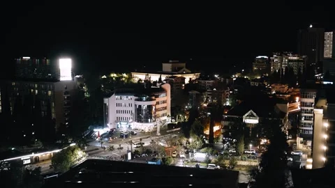 Night timelapse of a busy intersection in the city. Vehicles rush by on the road Stock Footage 334744288