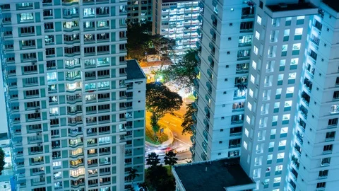 Night Timelapse of busy road between residential blocks Singapore Stock Footage 93186130