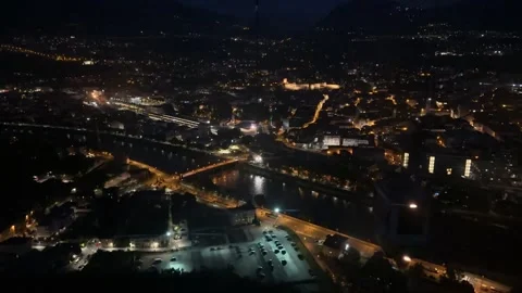Night timelapse of the cable car ride over brightly lit city Trento, Trenti.. Video stock 328204465