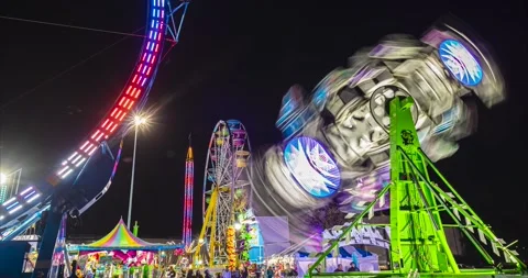Night timelapse of carnival rides in motion Stock Footage 238382441