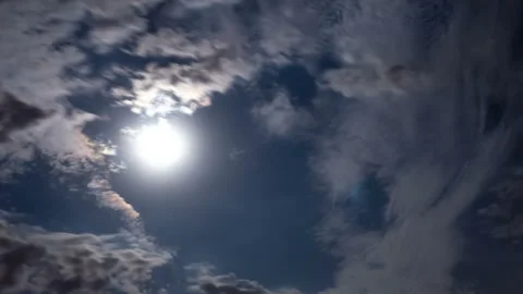 Night timelapse of clouds and moon Stock Footage 94888976