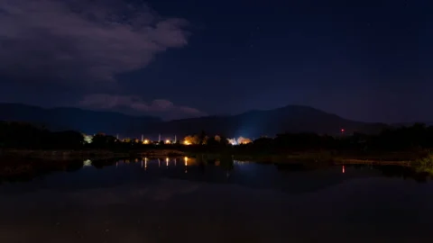 Night timelapse of distant mountains and stars in Hod, Chiang Mai, Thailand Stock Footage 228978380