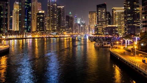 Night timelapse of Dubai with colorful boats Stock Footage