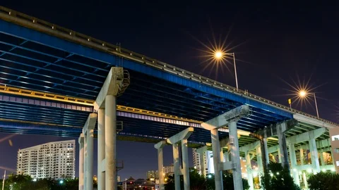 Night timelapse hyperlapse of a I-95 highway support bridge from below Stock Footage 100870540