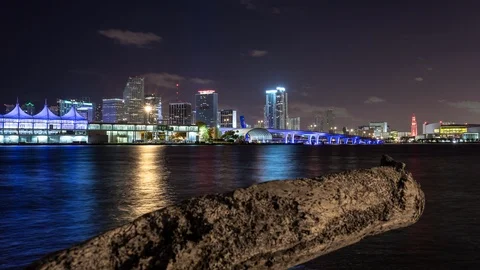 Night timelapse hyperlapse of Miami Brickell and downtown skyline over water Stock Footage 100870503
