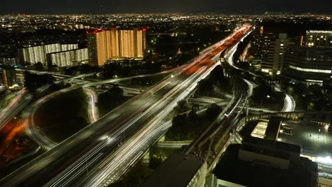 Night Timelapse of Junction Highway Traffic and Light Trails in Osaka Japan Video stock 331938334