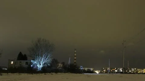 NIght timelapse light on tree, clouds going by 1080 Stock Footage 10768779