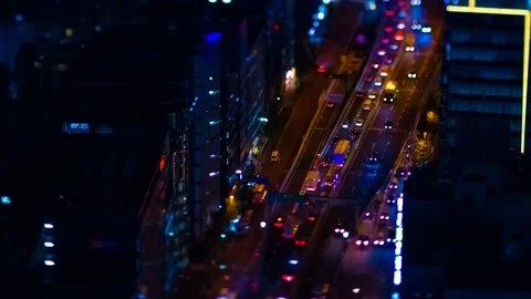 A night timelapse of the miniature highway at the urban city in Tokyo high angle Stock Footage