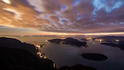 Night Timelapse over Ocean Inlet with Glowing Clouds and Moving Boats Stock Footage 73310016